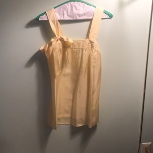 Easter egg yellow silk banana republic tank top with bow.